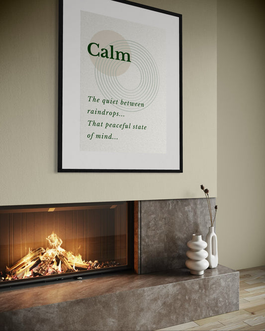 Framed poster with 'Calm' text above a fireplace in a room.