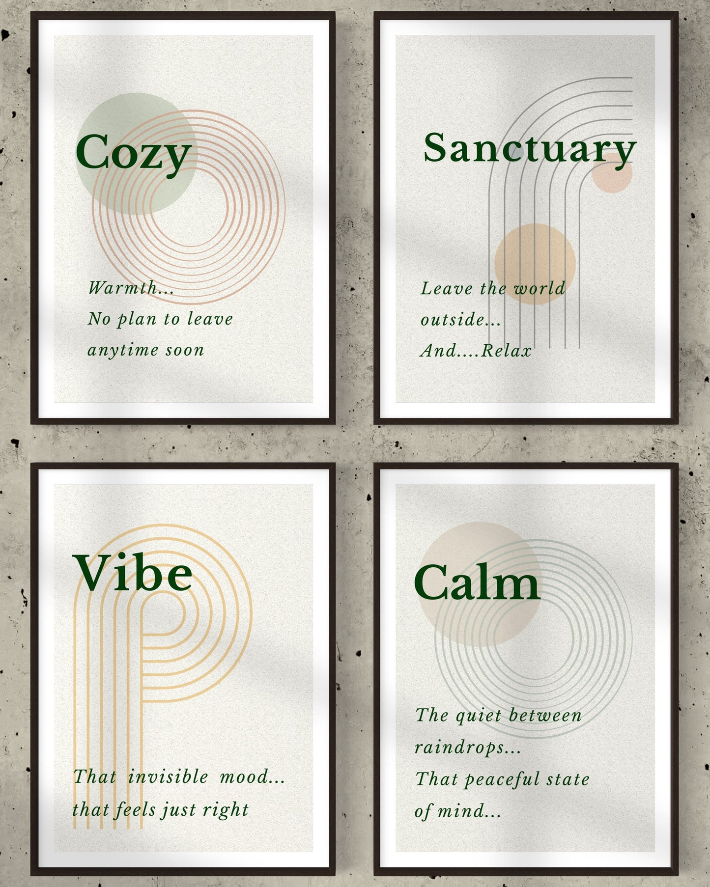 Four framed prints with motivational phrases on a concrete wall background