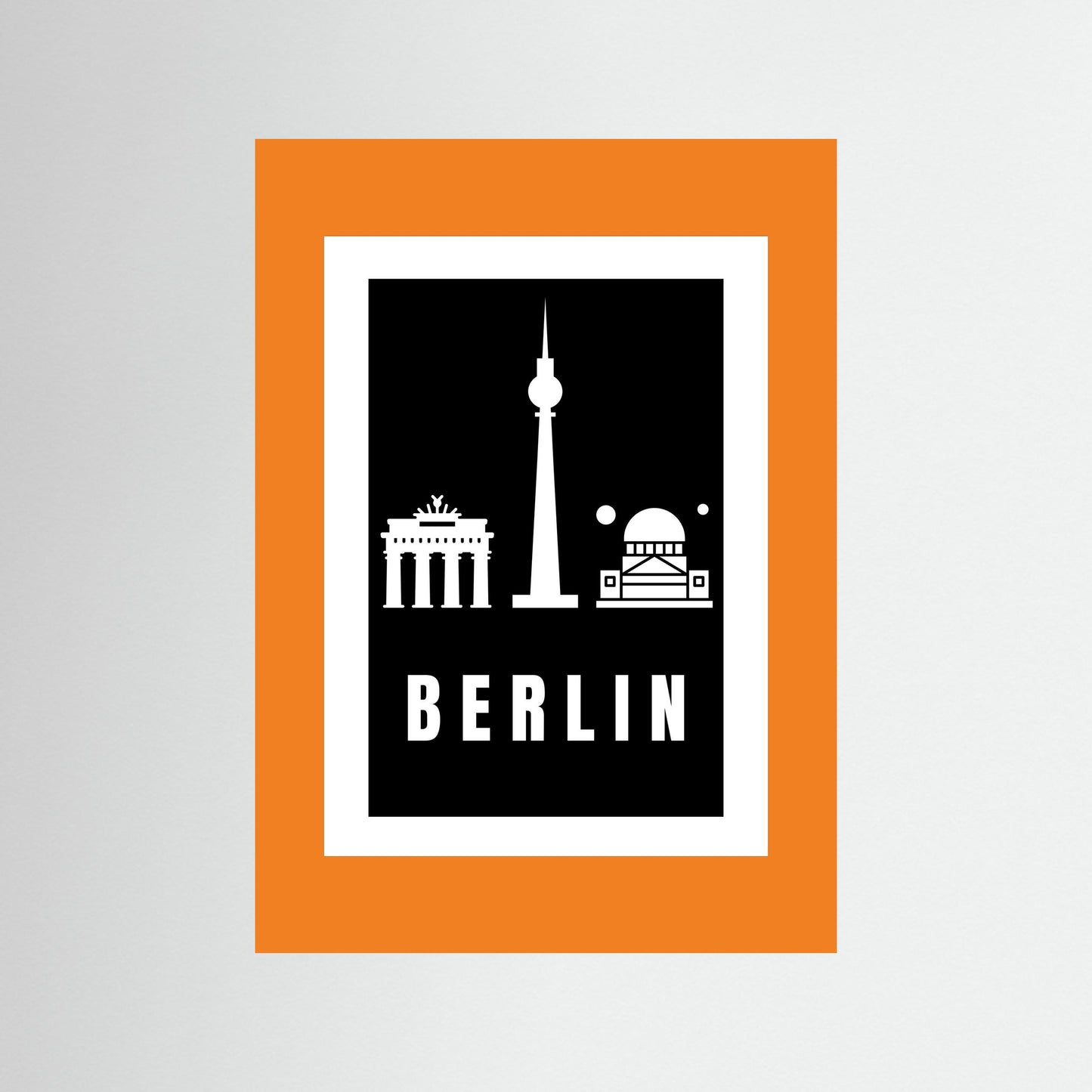 Unframed poster with Berlin landmarks and 'BERLIN' text on a black background with an orange border.