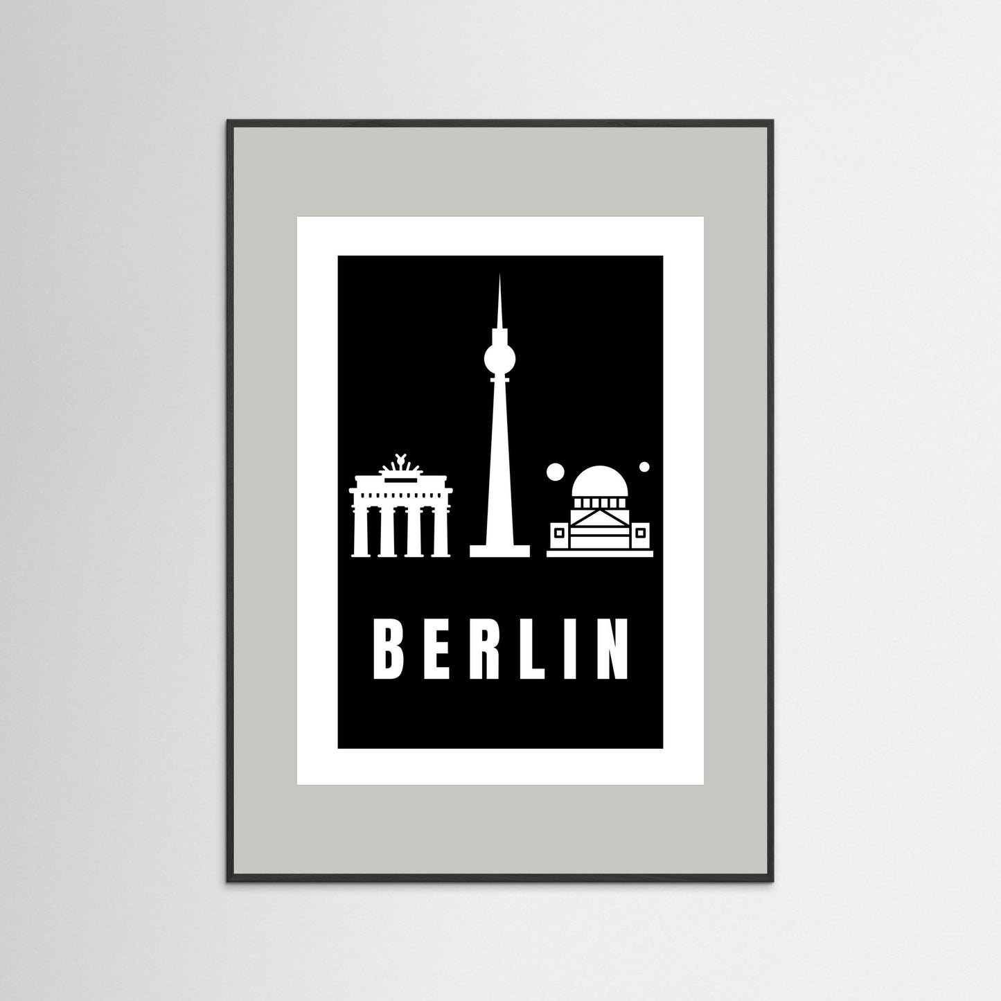 Framed poster with Berlin landmarks on a black background and a light grey border.