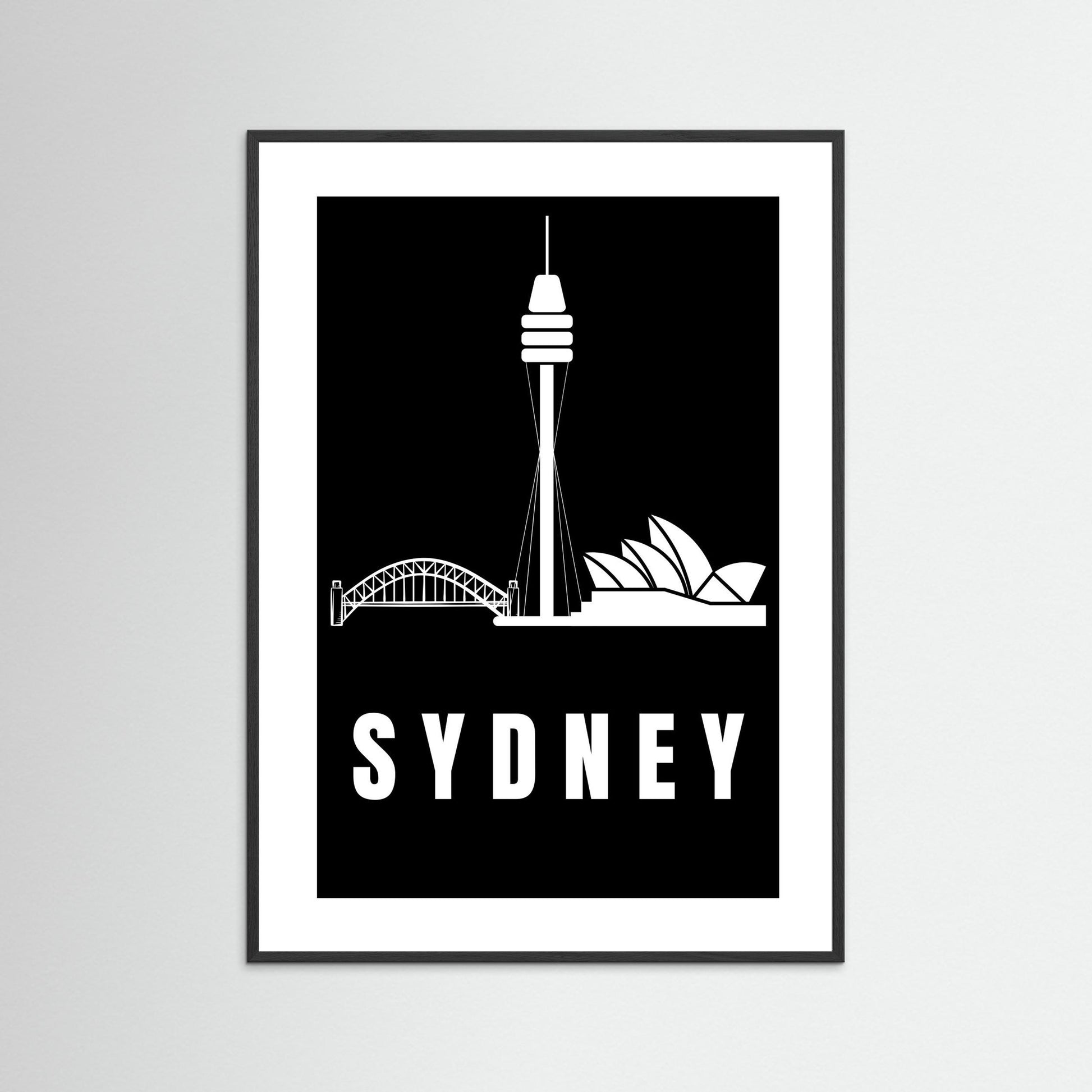 Framed artwork of Sydney's landmarks on a black background with 'SYDNEY' text.