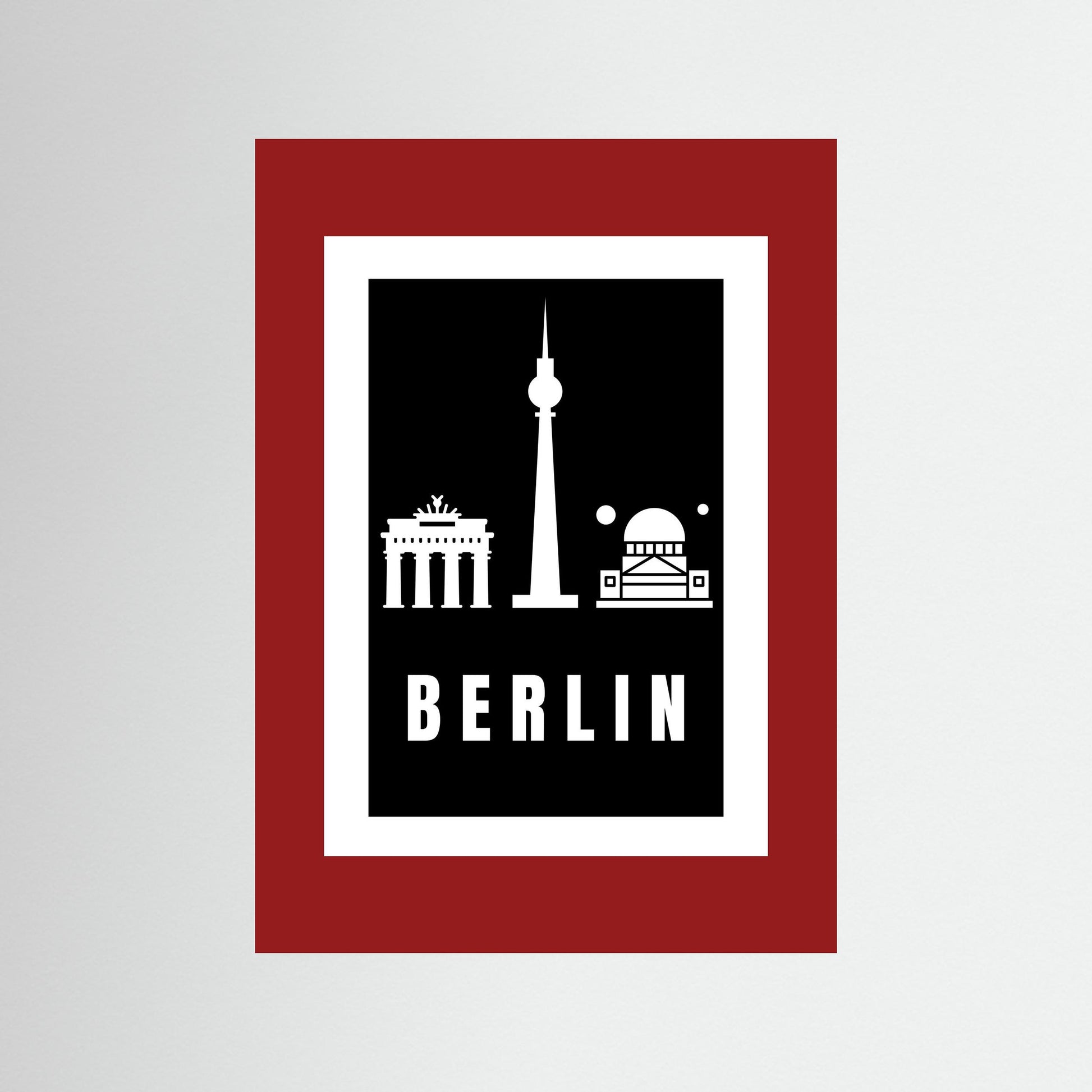 Unframed poster with Berlin landmarks and 'BERLIN' text on a black background and deep red border