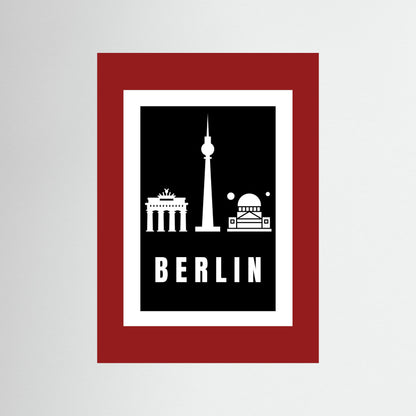 Unframed poster with Berlin landmarks and 'BERLIN' text on a black background and deep red border