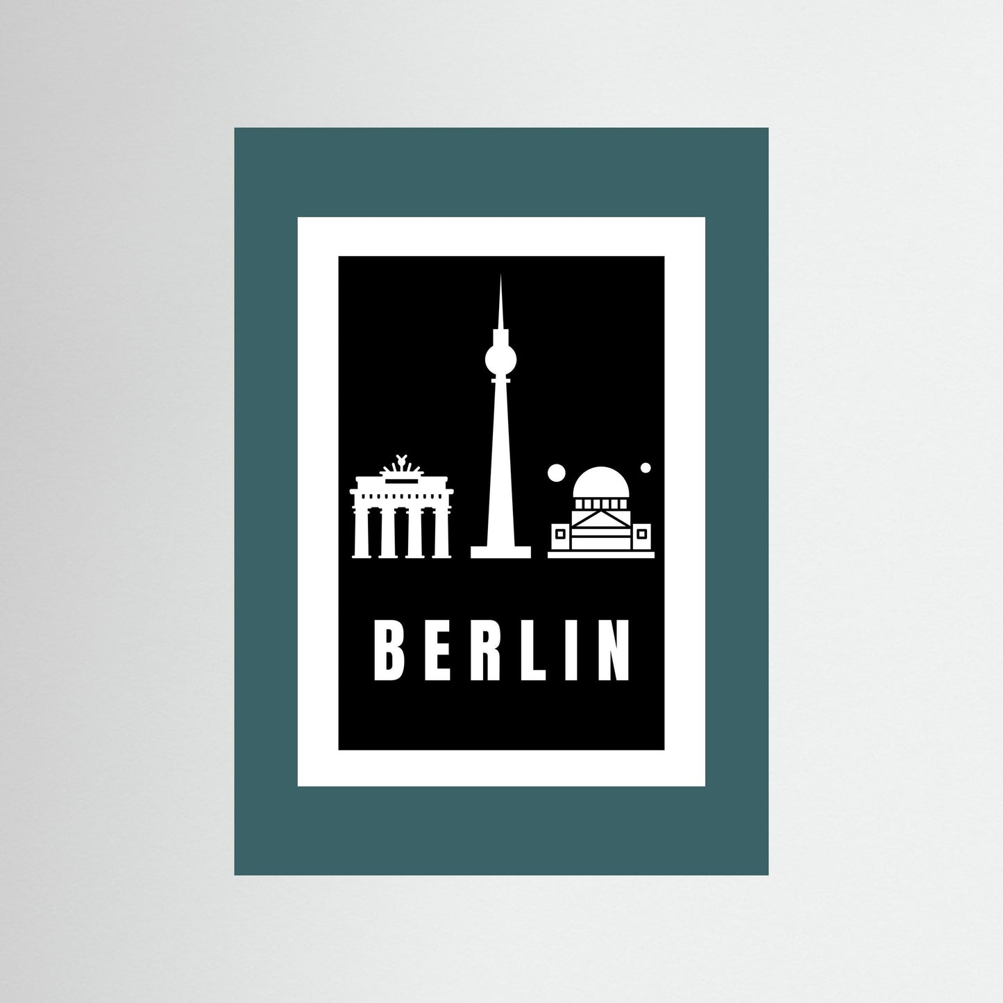 Unframed poster with Berlin landmarks and 'BERLIN' text on a black background and teal border