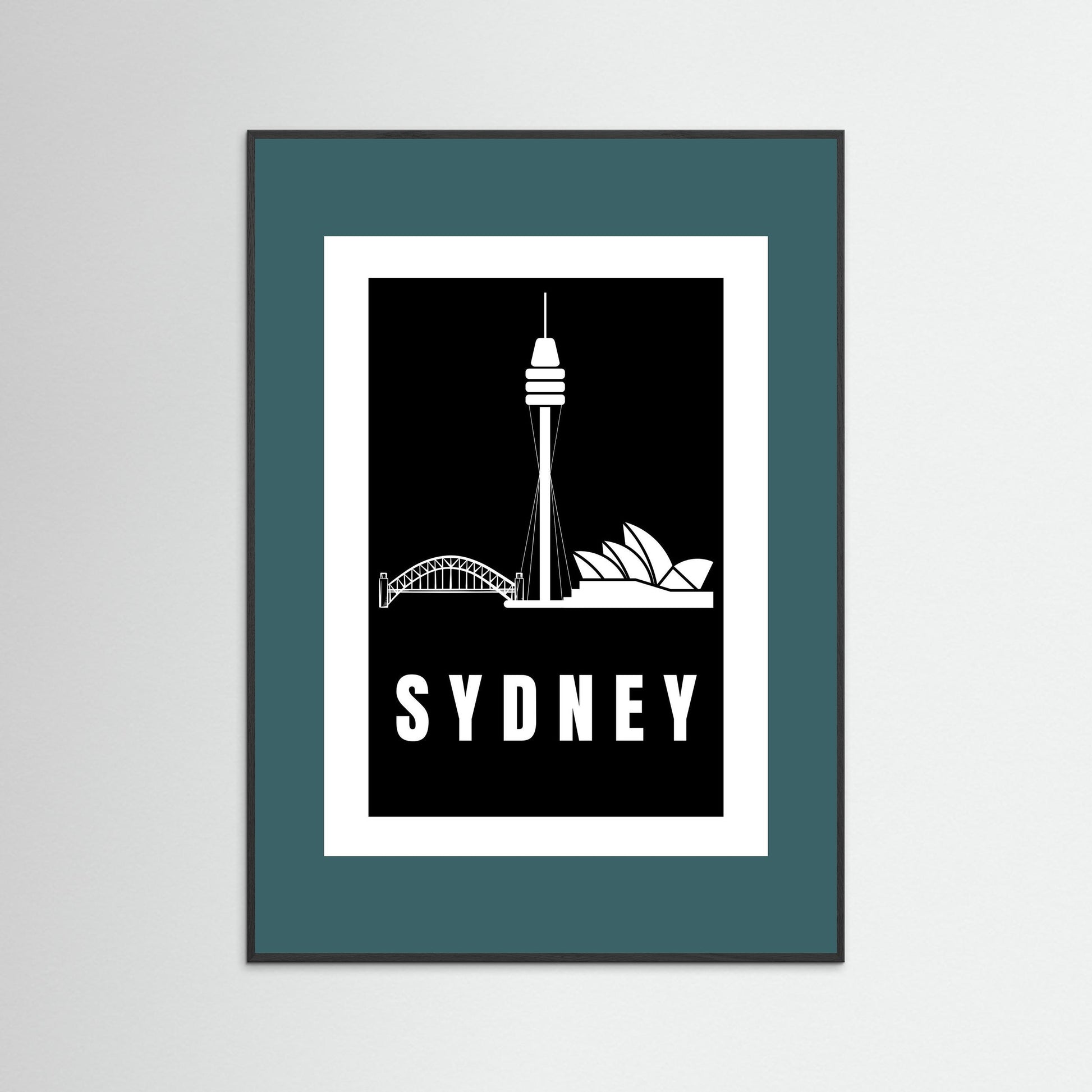Framed artwork with Sydney skyline silhouette and 'Sydney' text on a black background with a teal border