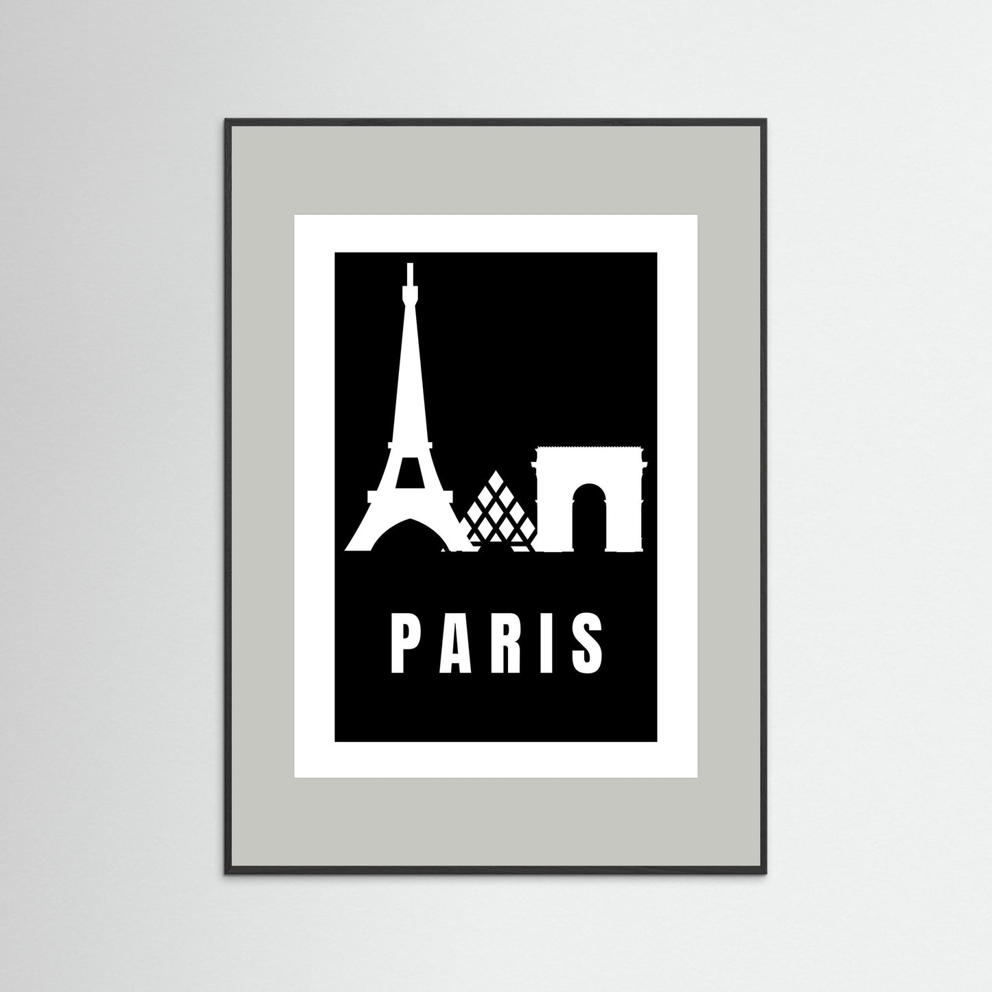 Framed poster with Eiffel Tower and Arc de Triomphe silhouettes and 'PARIS' text on a black background. Framed with a light grey border.