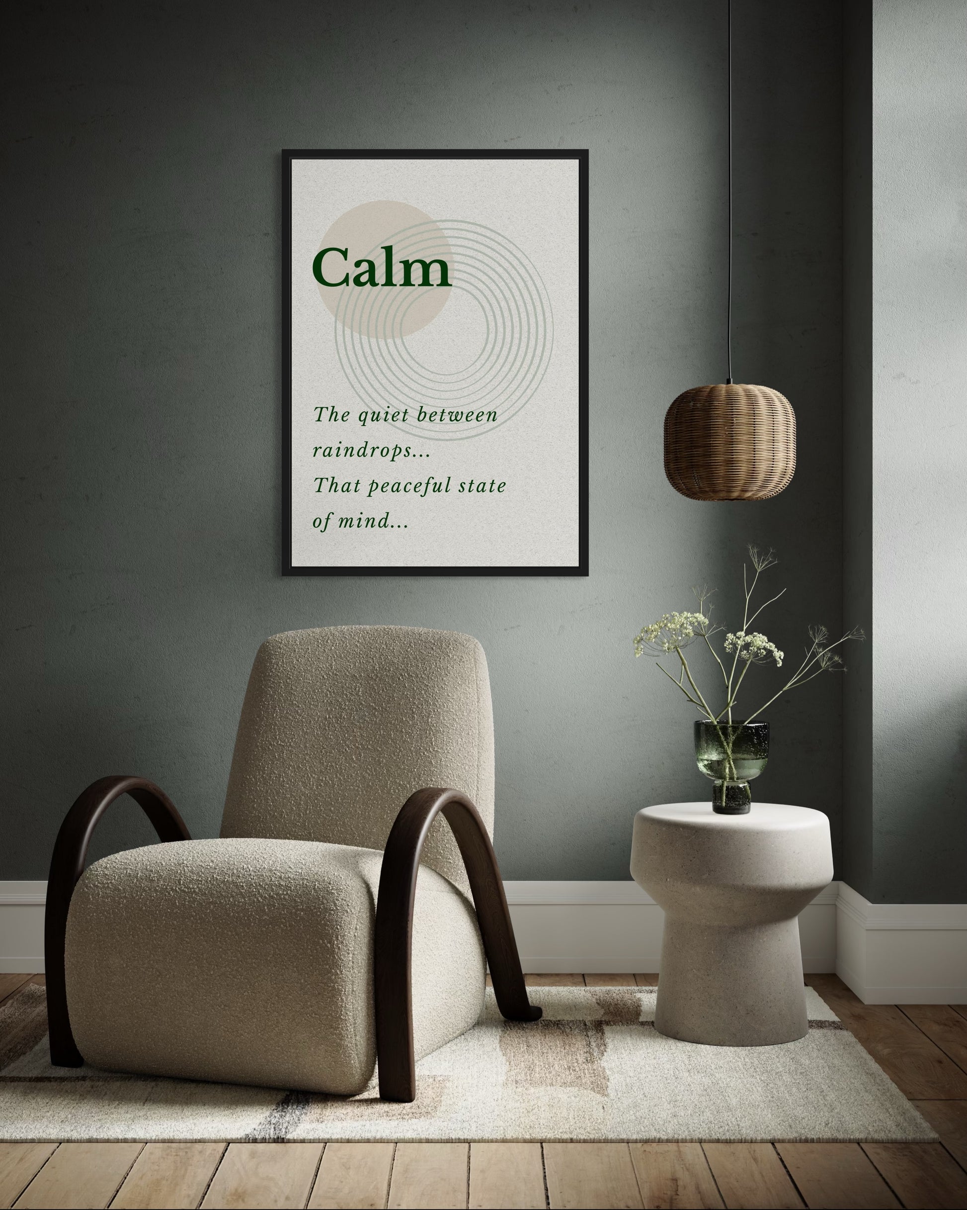 Beige armchair in a room with a framed picture on the wall displaying the word 'Calm'.