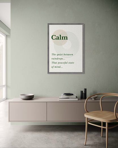 Framed poster with the word 'Calm' and a definition in a modern interior setting.