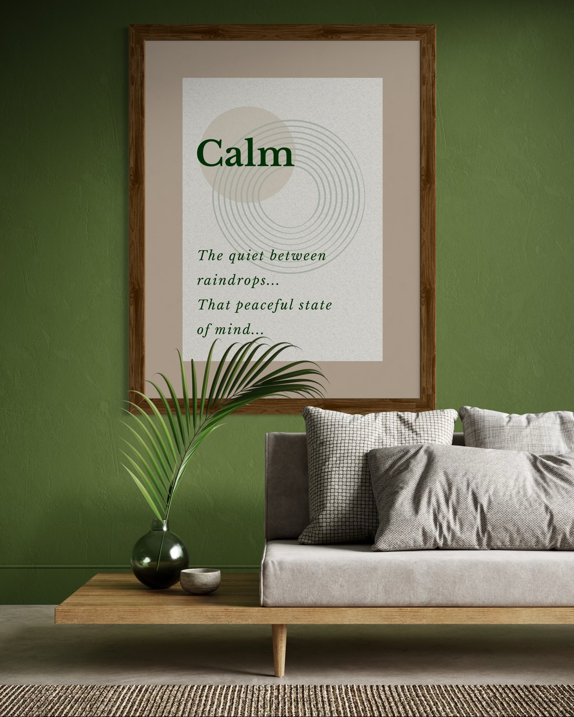 Living room with a framed poster on the wall, a sofa, and decorative items.