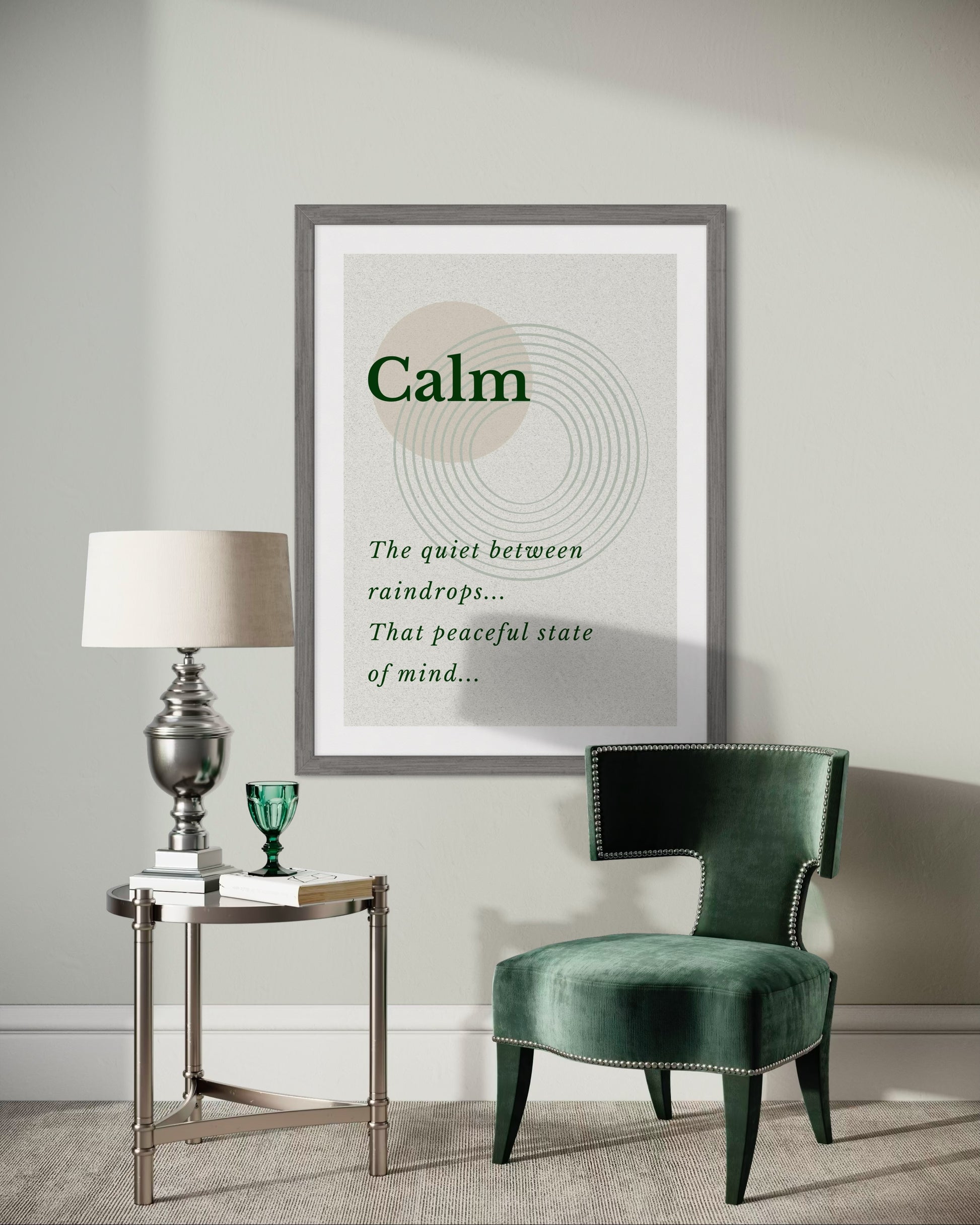Modern interior with a green chair, lamp, and framed poster on a gray wall.