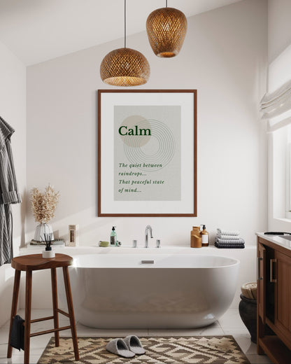 Modern bathroom with a freestanding bathtub, wooden stool, and framed poster on the wall.