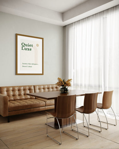 Modern dining room with brown leather sofa, table, and chairs, and a framed poster on the wall.