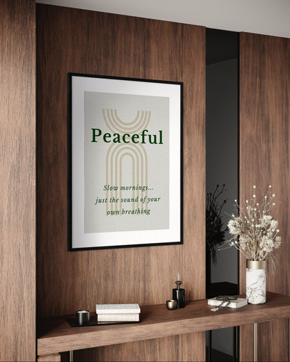 Framed artwork with 'Peaceful' text on a wooden wall with decor items below.