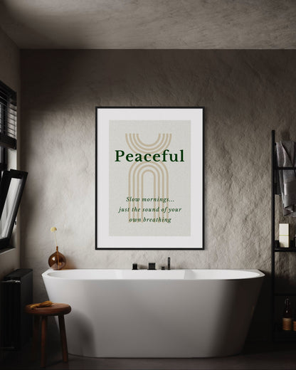 Bathroom with a framed poster reading 'Peaceful' above a bathtub.