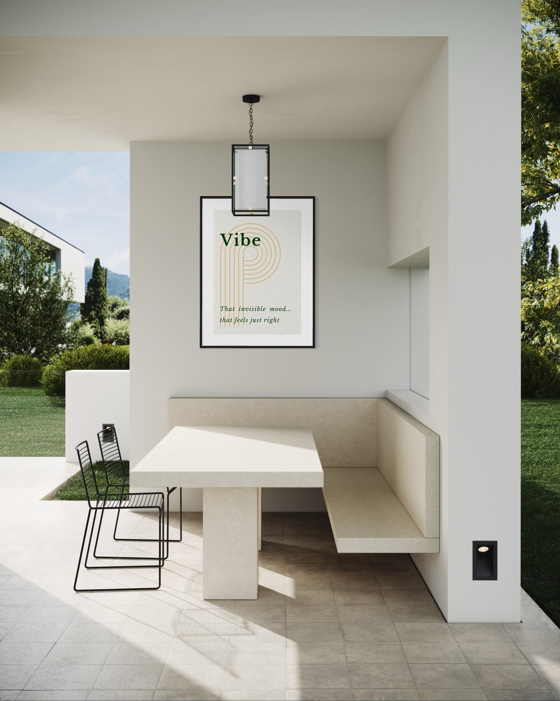 Modern outdoor seating area with a table and chairs, featuring a 'Vibe' framed picture on the wall.