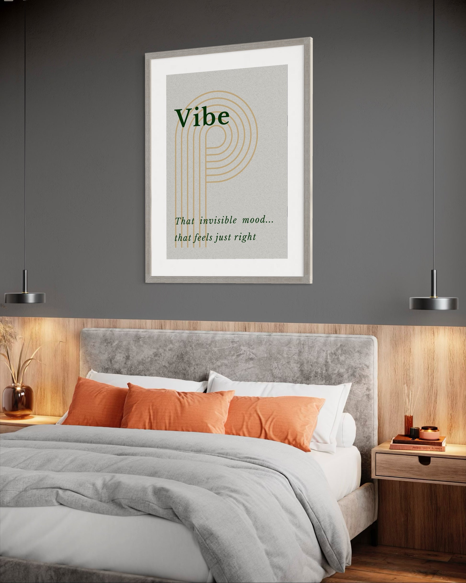 Framed artwork above a bed with orange and white pillows in a bedroom setting.