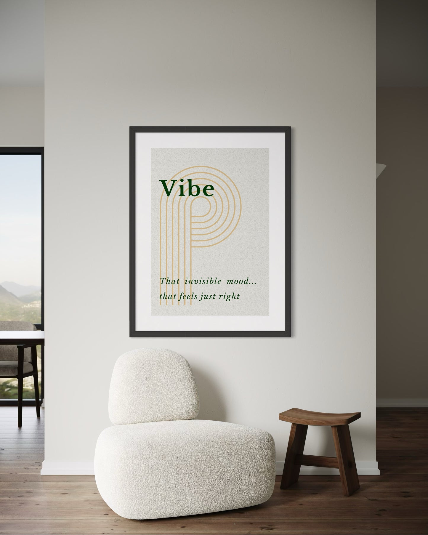 Framed artwork with text on a wall in a room with a chair and stool.