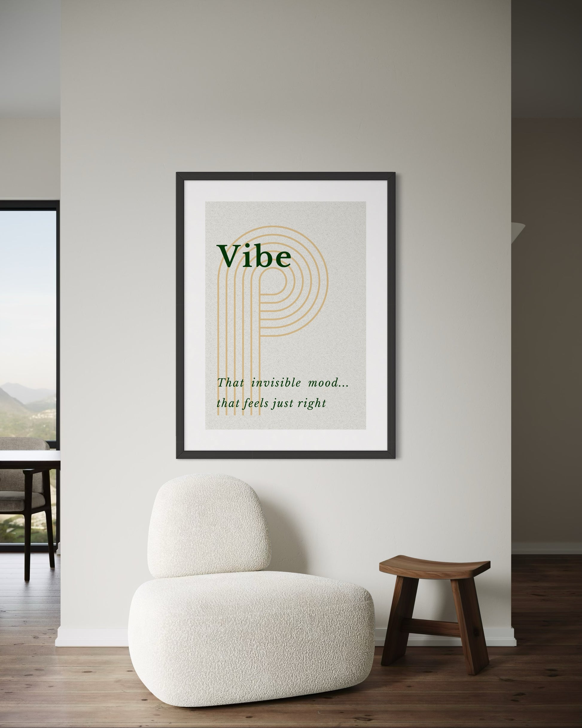 Framed artwork with text on a wall in a room with a chair and stool.