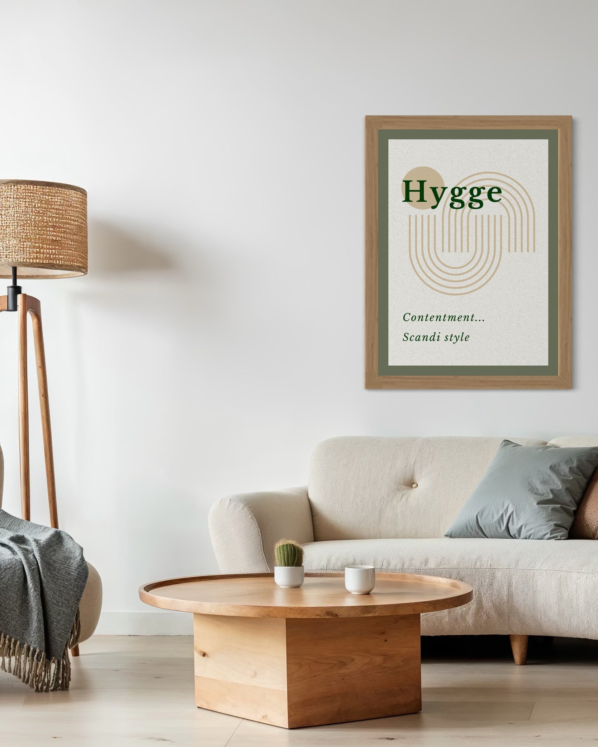 Living room with a 'Hygge' poster on the wall, a beige sofa, wooden coffee table, and lamp.