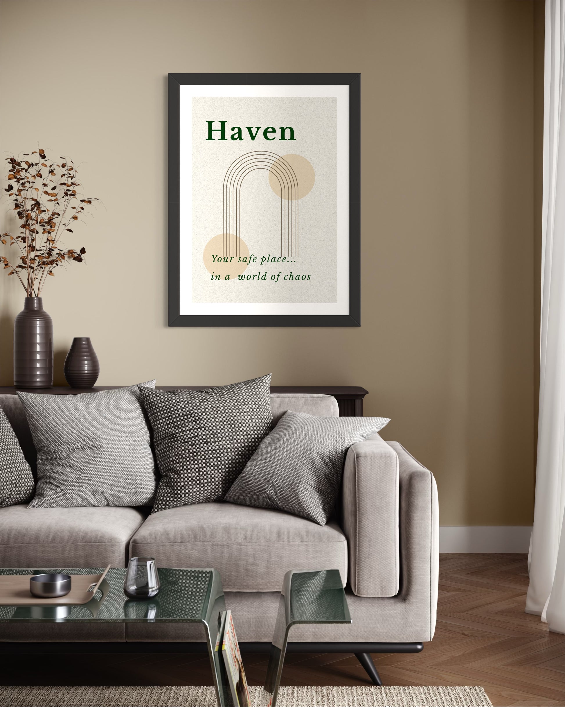 Living room with a gray sofa, coffee table, and framed artwork on the wall.