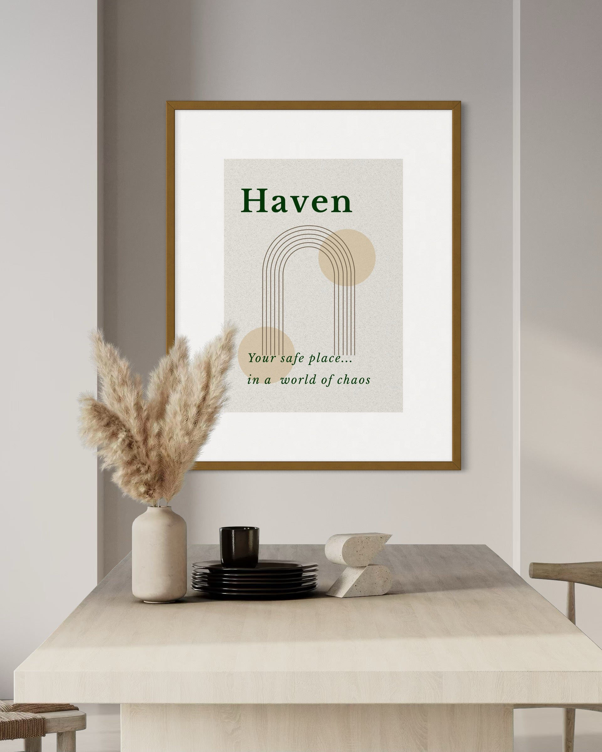 Framed artwork with 'Haven' quote on a wall above a table with decorative items.