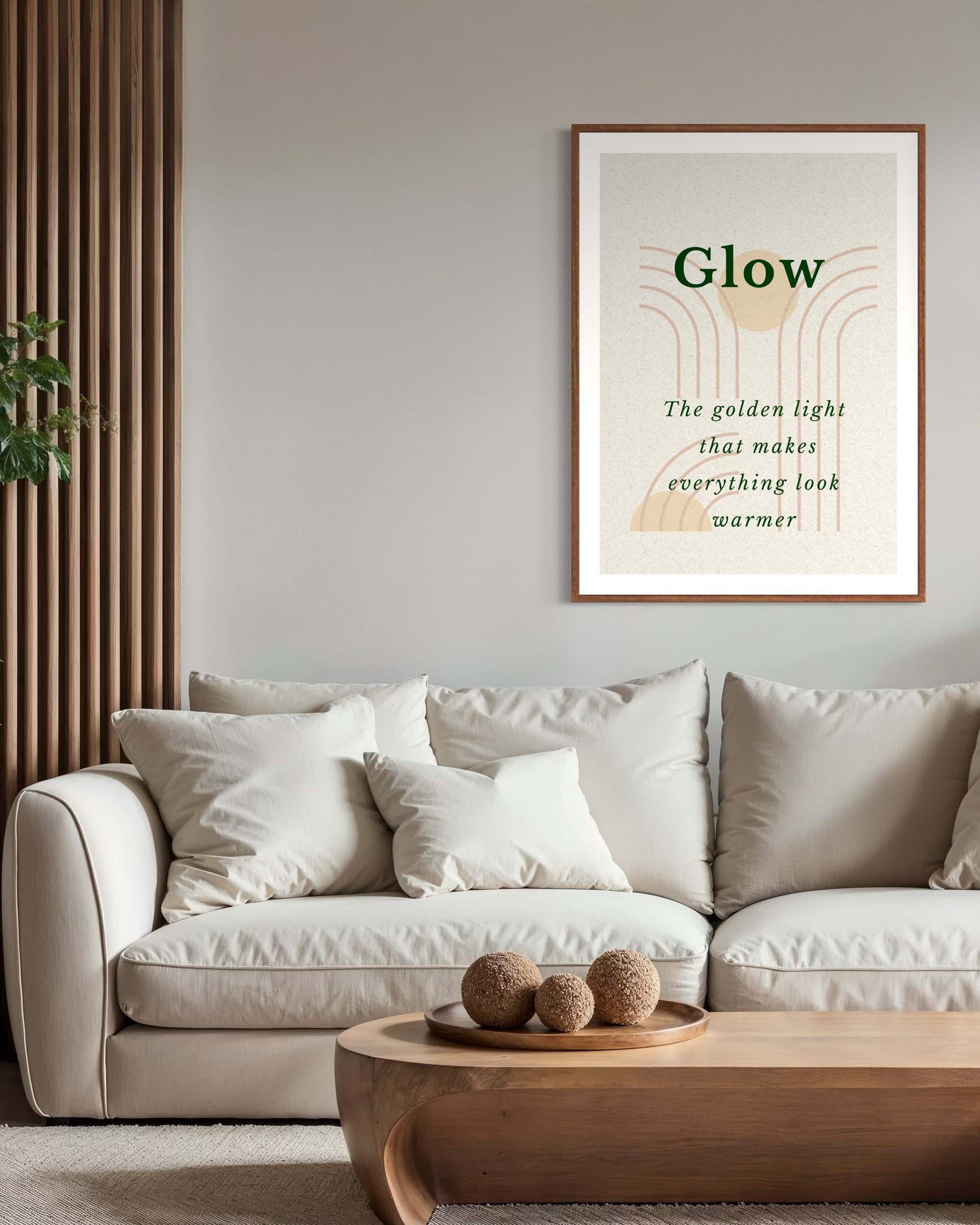 Living room with a beige sofa, wooden coffee table, and framed artwork on the wall.