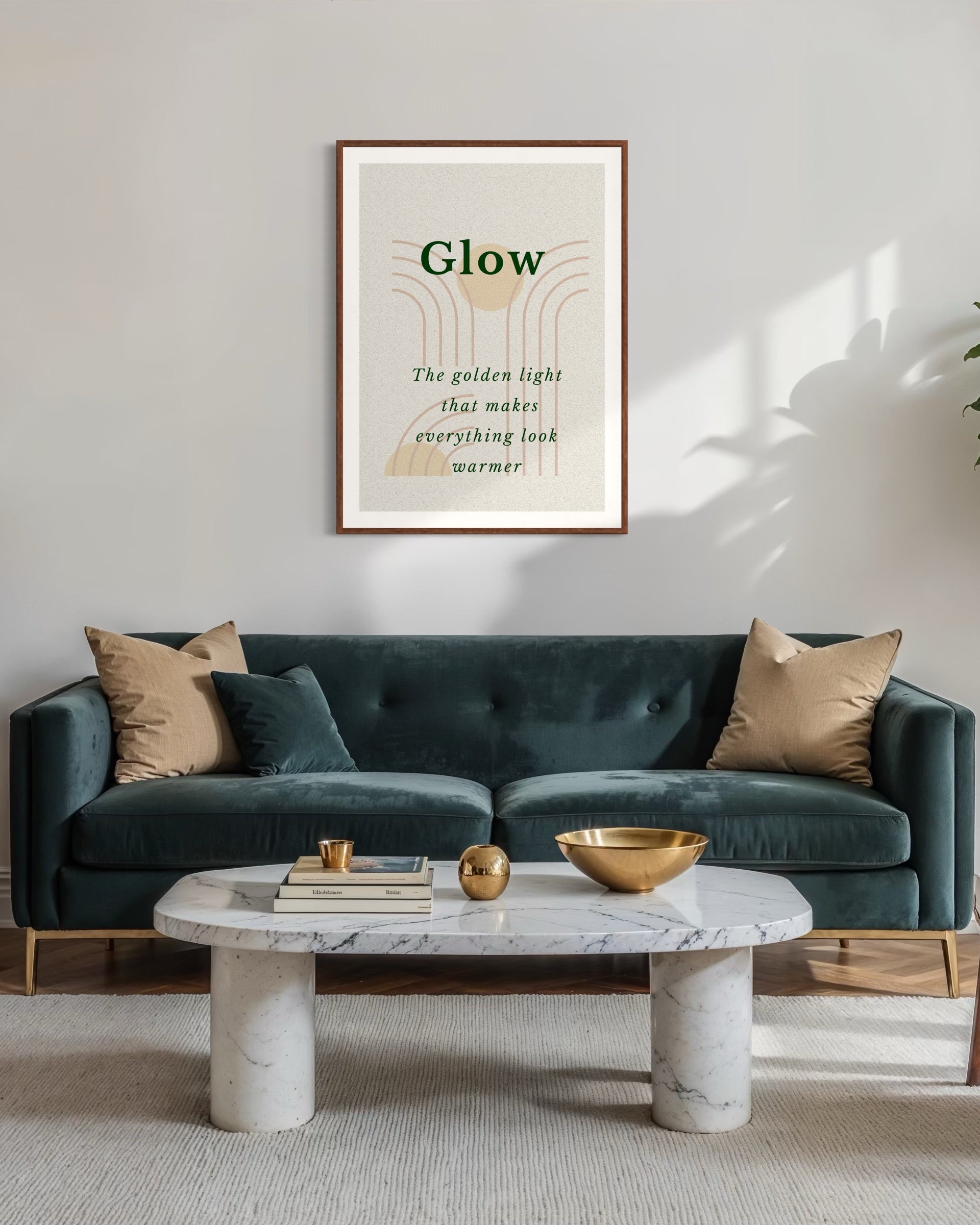 Living room with a green sofa, marble coffee table, and framed artwork on the wall.