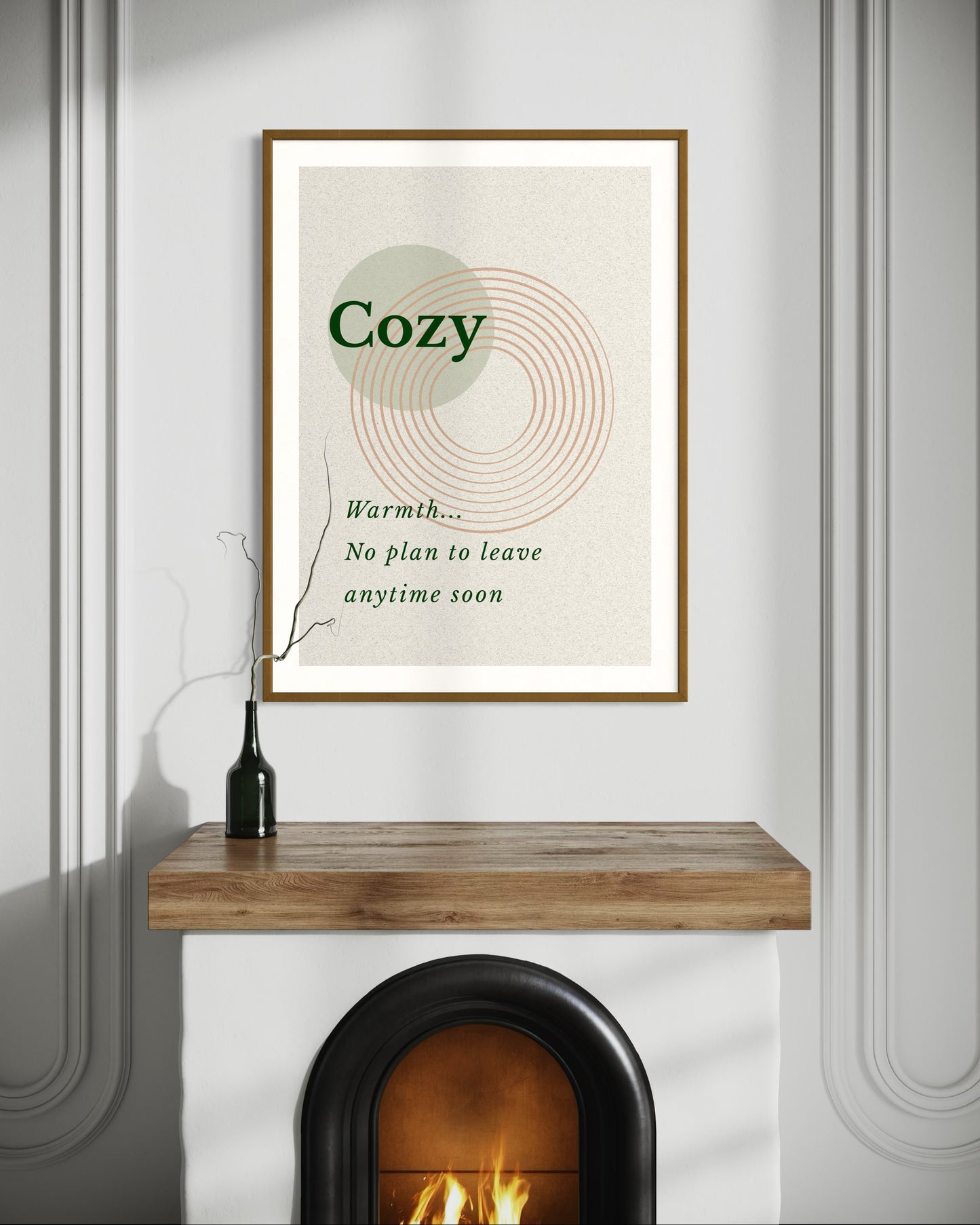 Framed artwork with the word 'Cozy' on a wall above a fireplace.