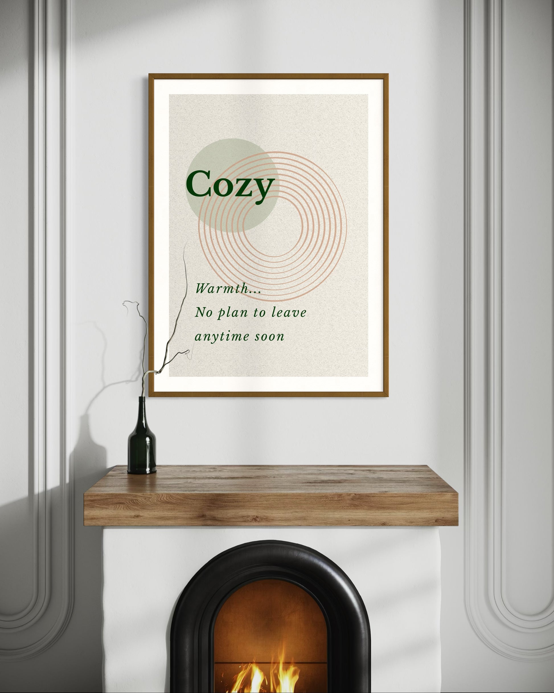 Framed artwork with the word 'Cozy' on a wall above a fireplace.
