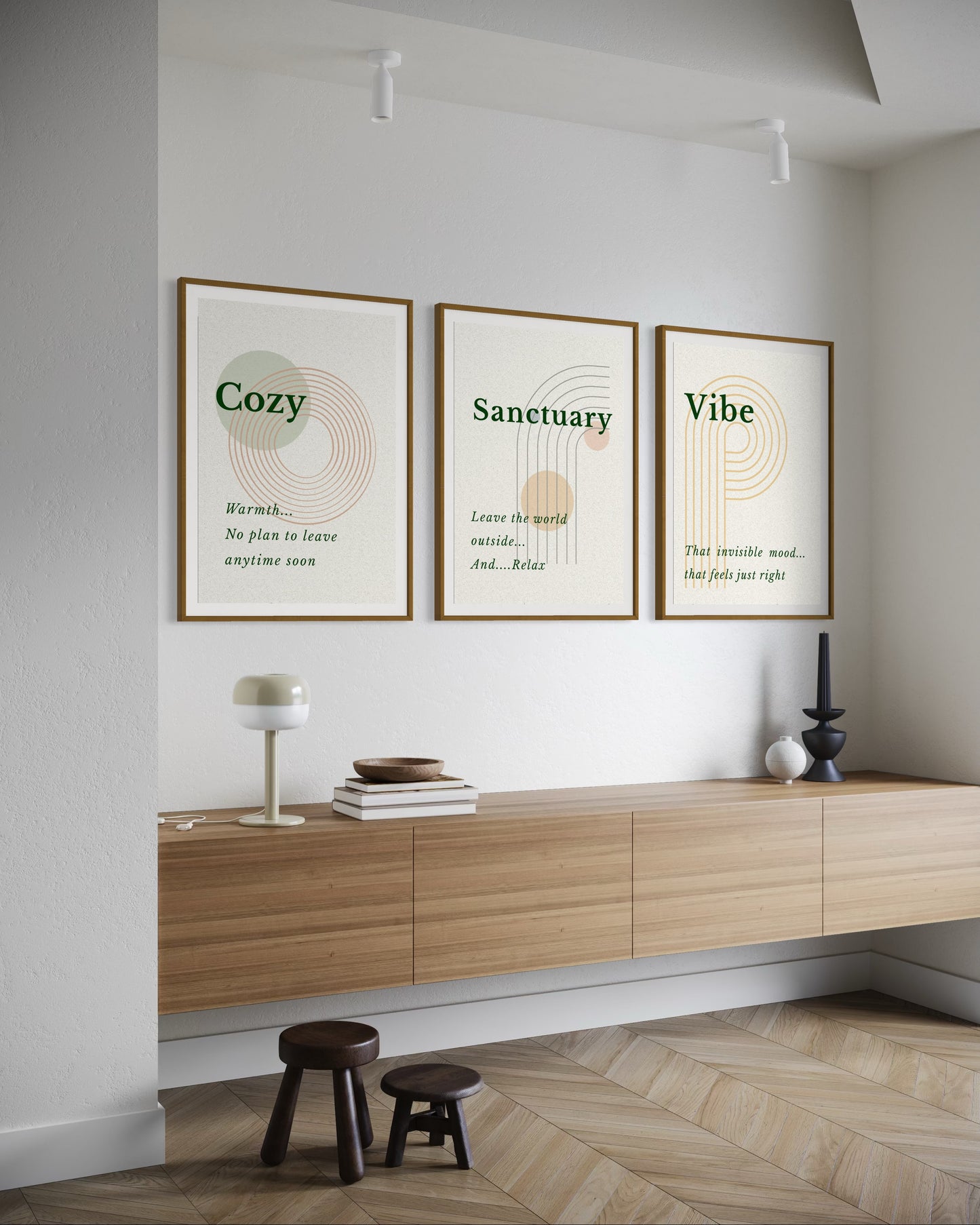 Modern interior with wooden console table, framed prints, and decorative items.