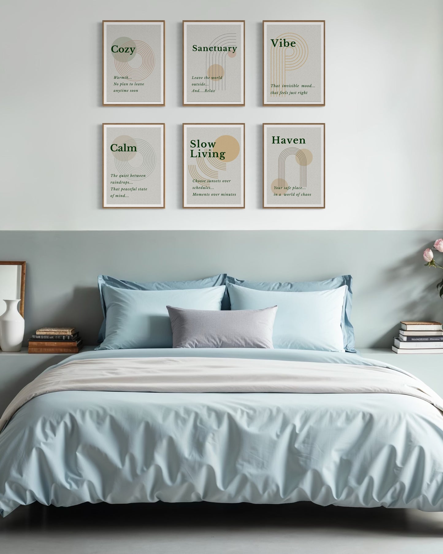 Bedroom with light blue bedding and framed prints on the wall.