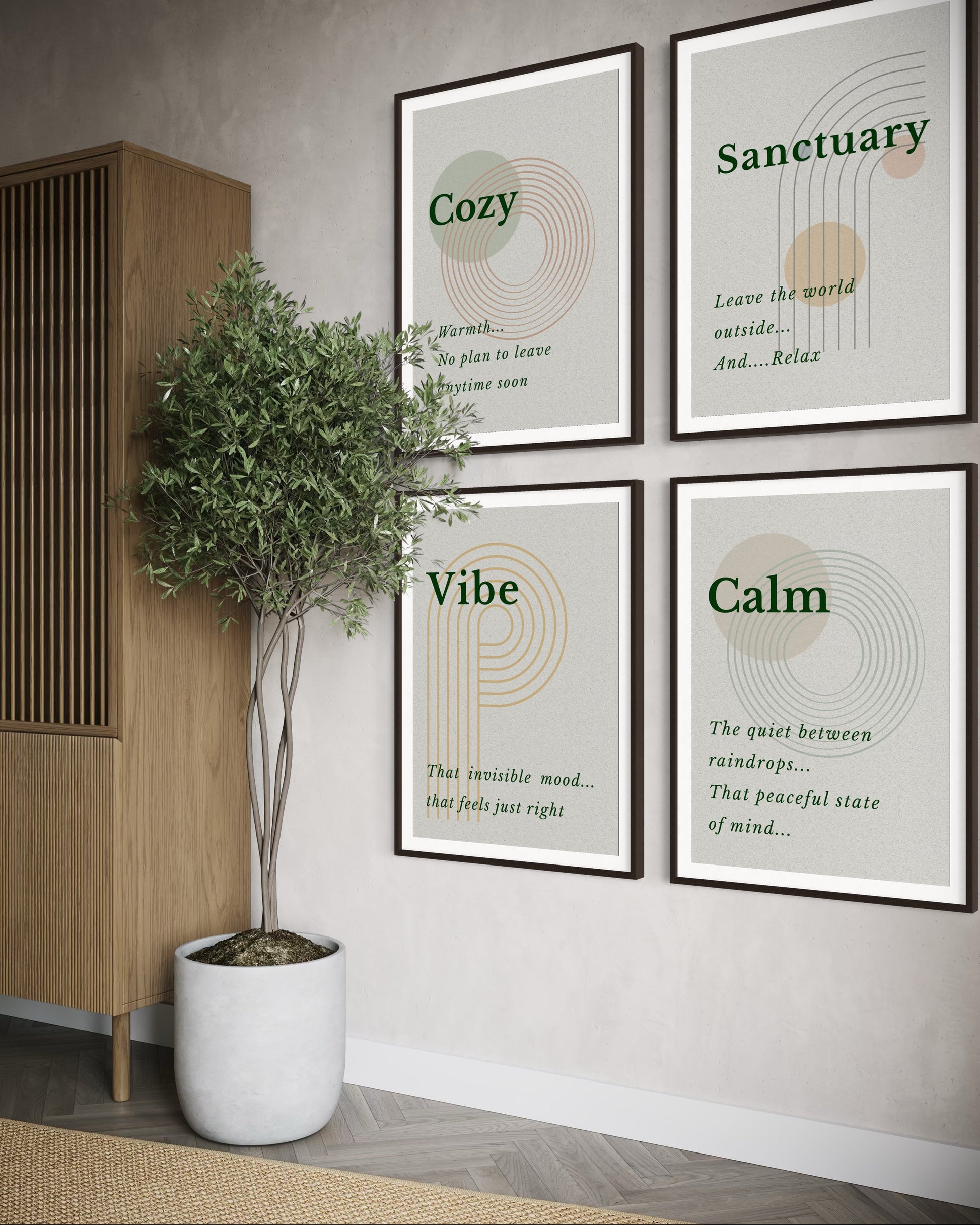 Four framed prints on a wall with decorative elements and a plant.