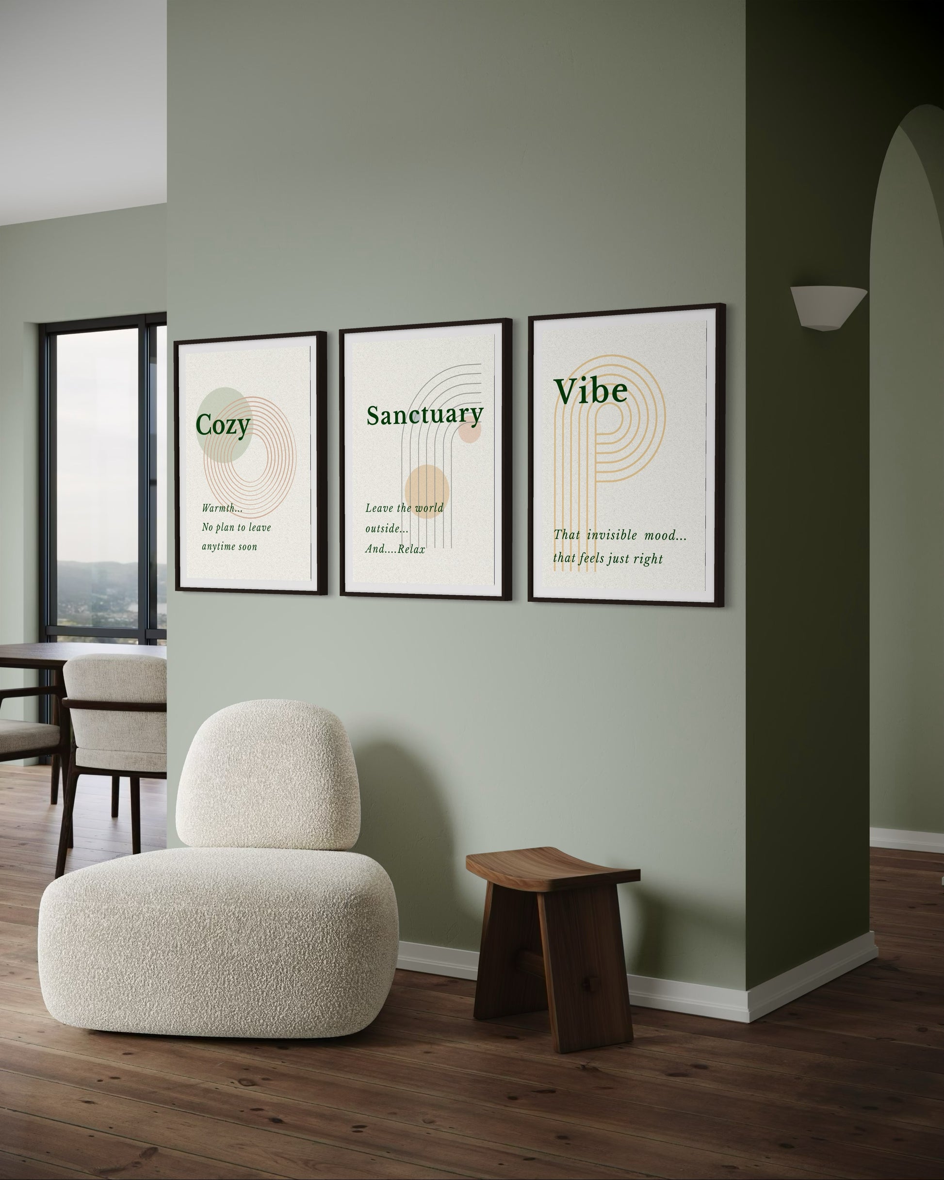 Modern interior with a chair, wooden stool, and framed wall art on a green wall.