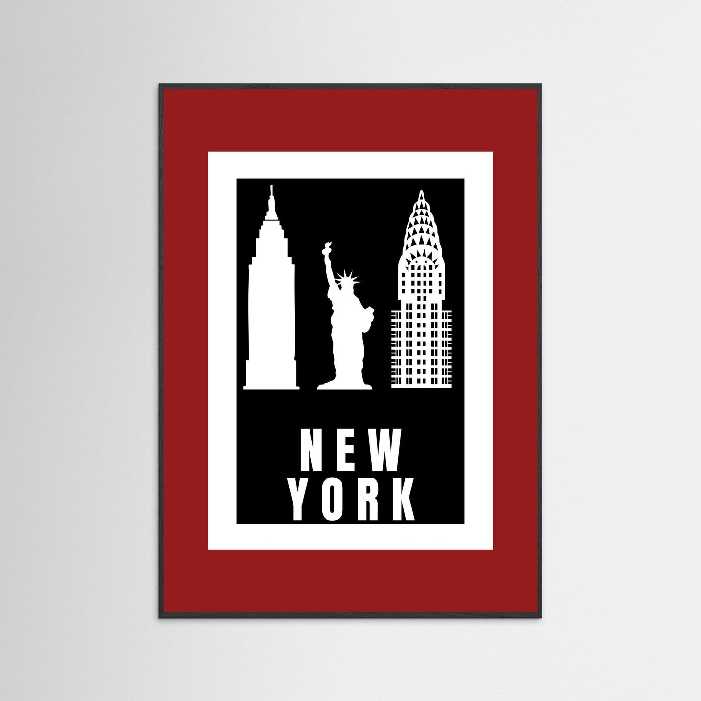 Framed artwork with silhouettes of New York landmarks on a black background with 'NEW YORK' text. with a deep red border