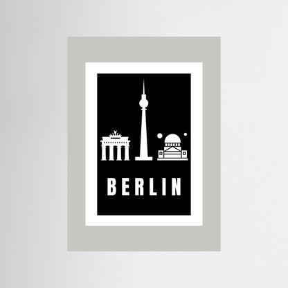 Unframed poster with Berlin landmarks on a black background with light grey border.