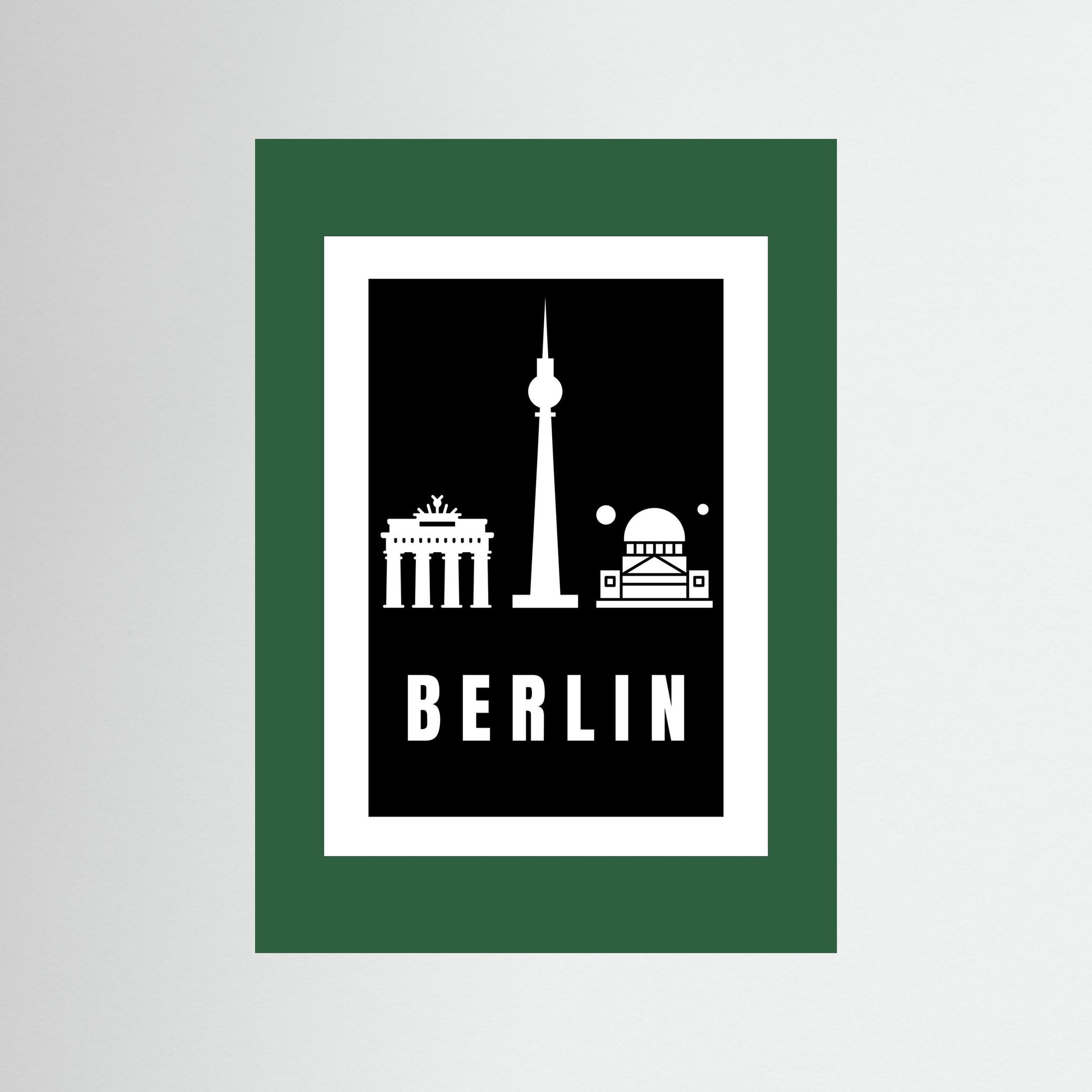 Unframed poster with Berlin landmarks and 'BERLIN' text on a black background with a dark green border