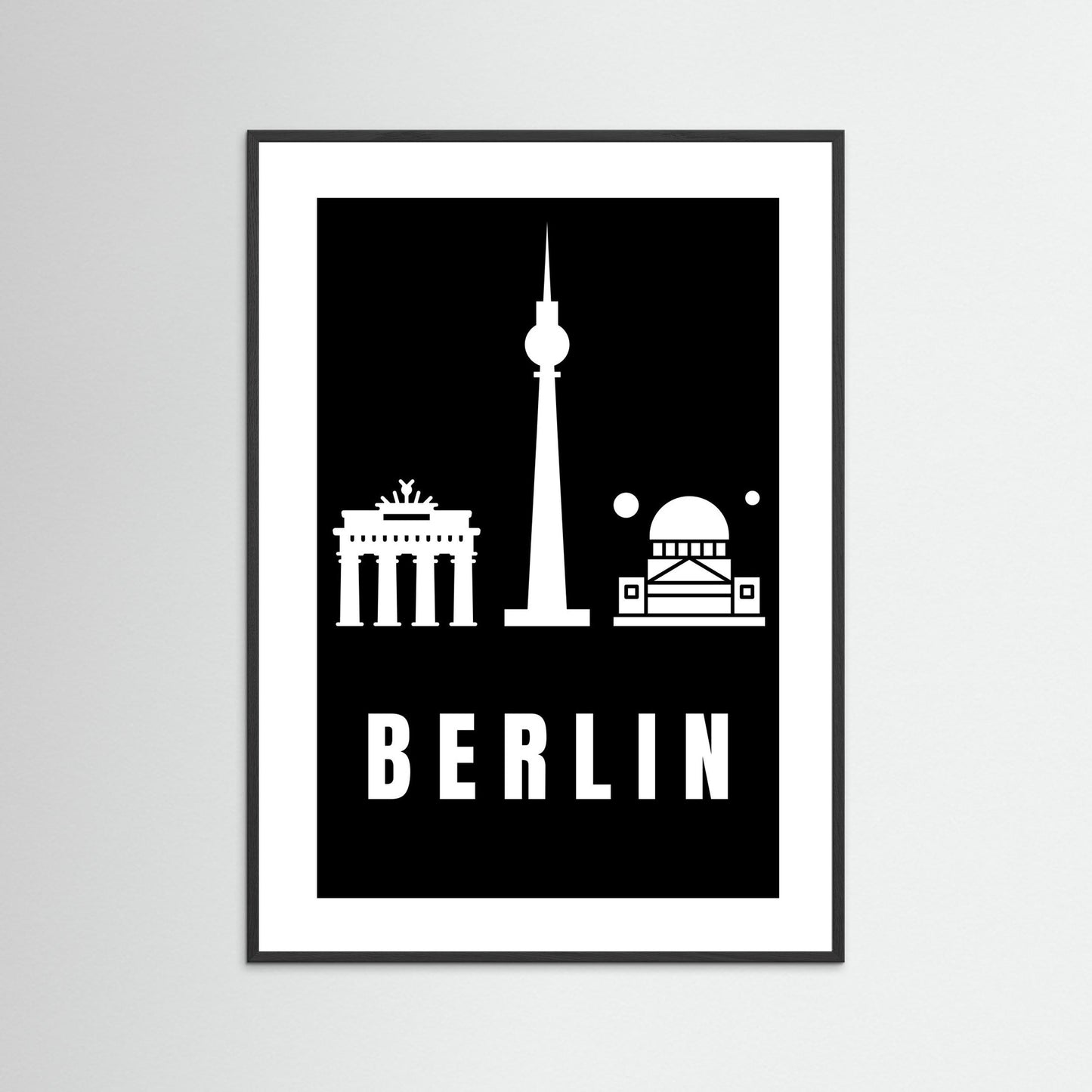Framed poster with Berlin landmarks on a black background
