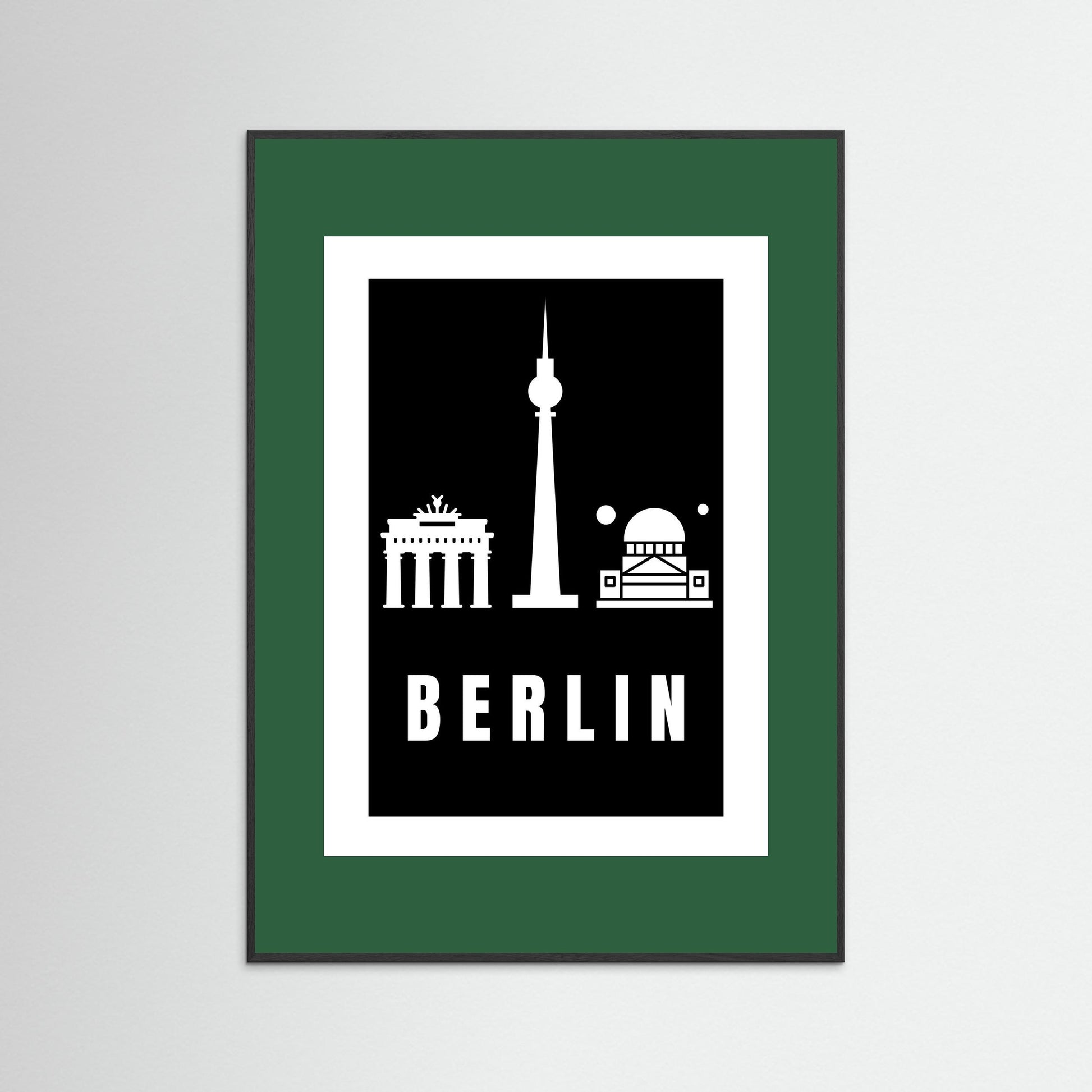 Framed poster with Berlin landmarks on a black background with dark green border