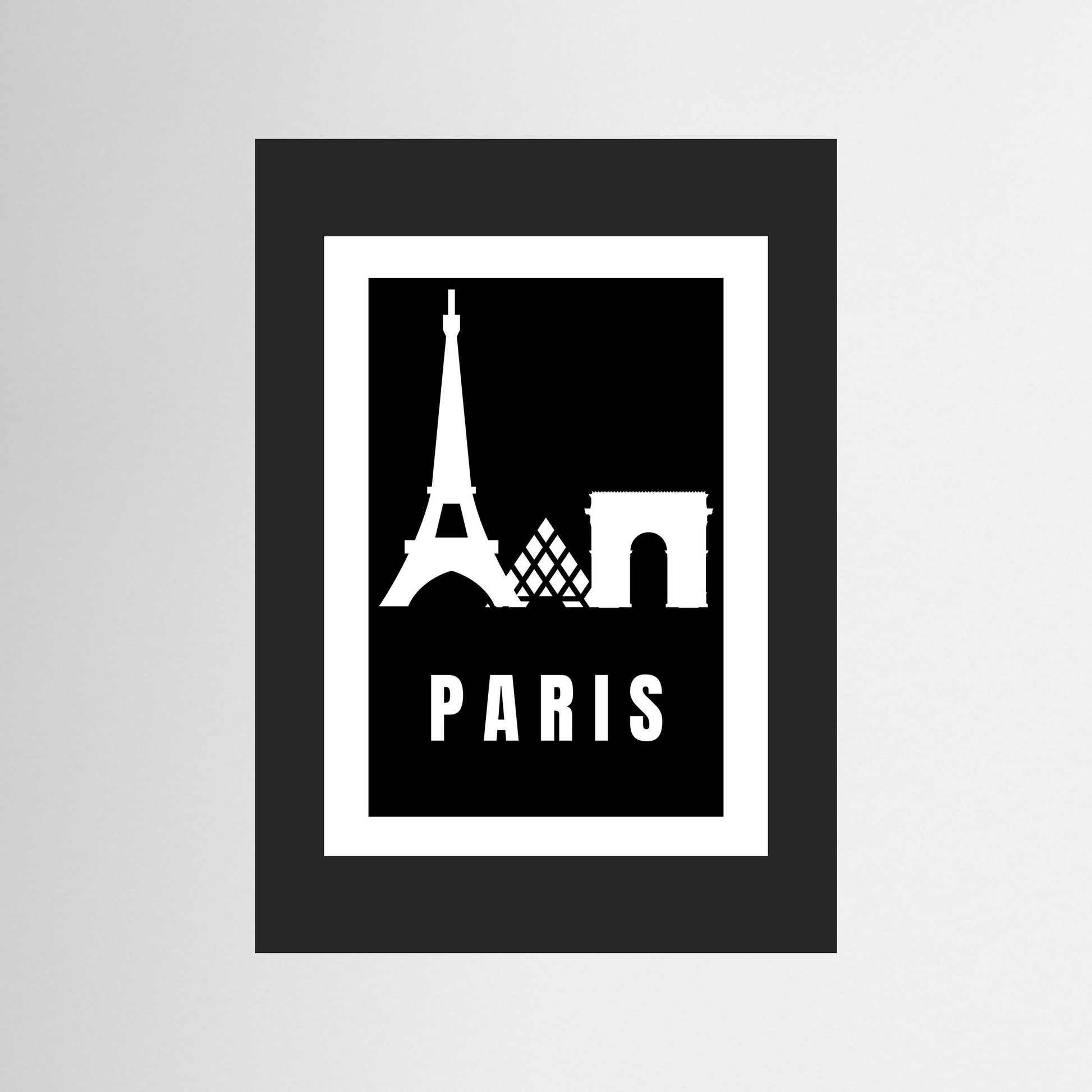 Framed artwork with Eiffel Tower and Arc de Triomphe silhouettes and 'PARIS' text on a black background.