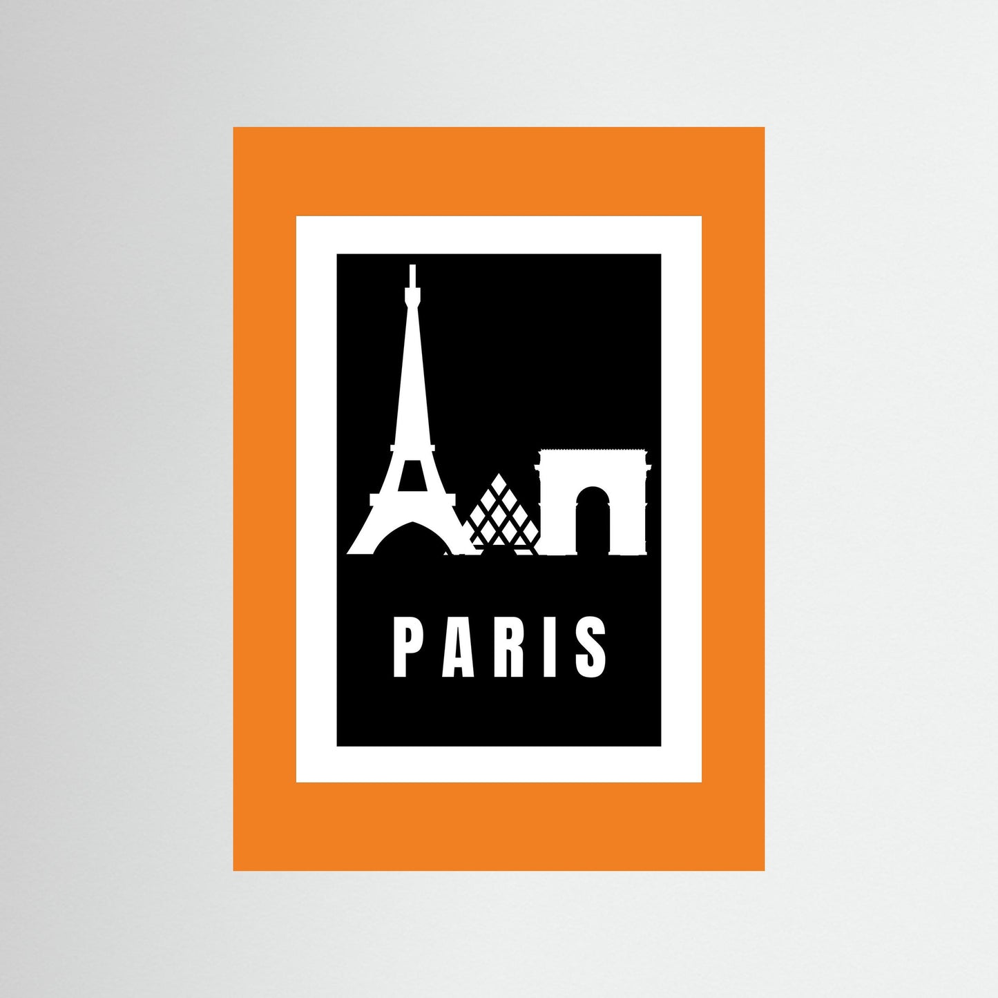 Framed poster with Eiffel Tower and Arc de Triomphe silhouettes on a black background with 'PARIS' text, framed in orange.
