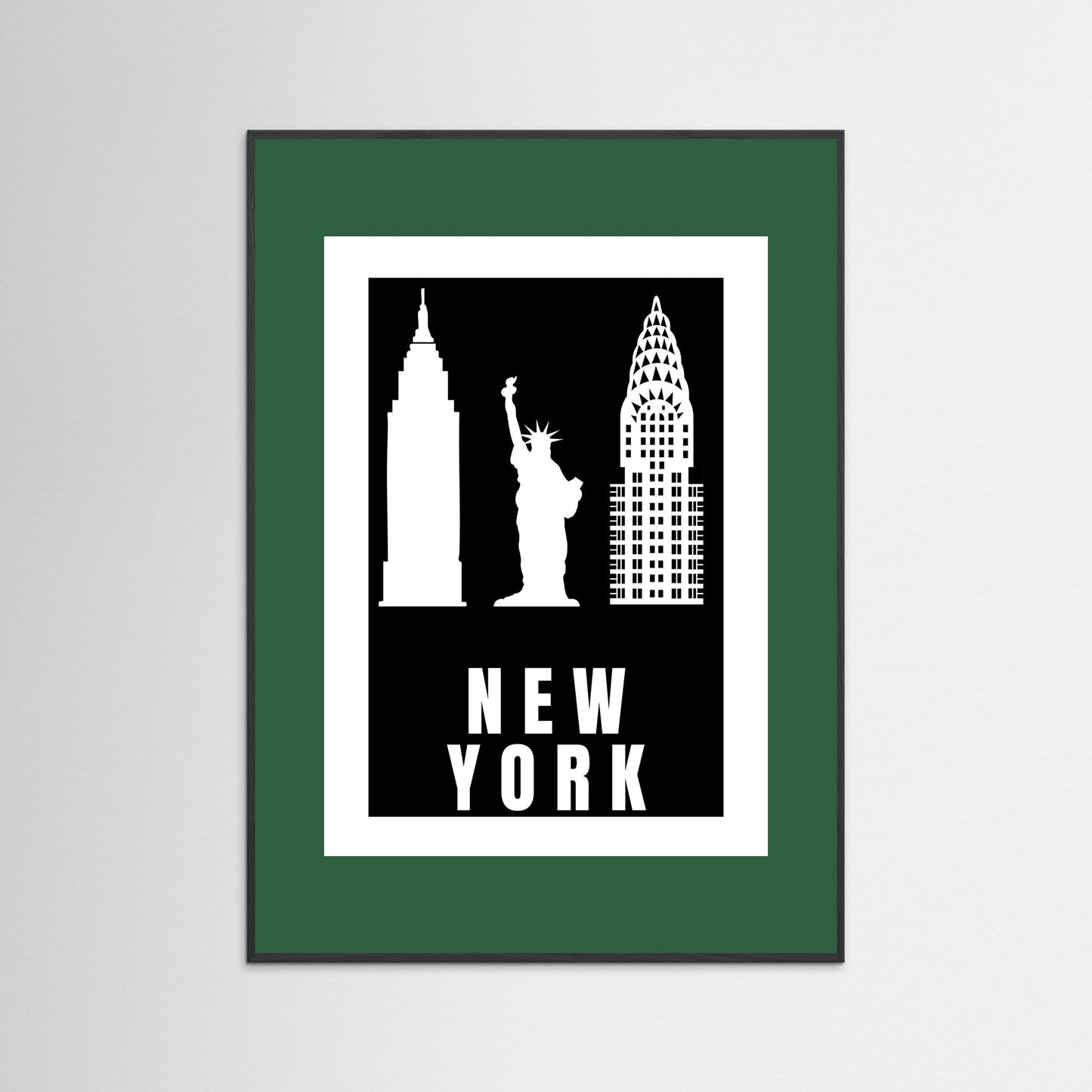 Framed artwork with New York City landmarks on a black background with a dark green border