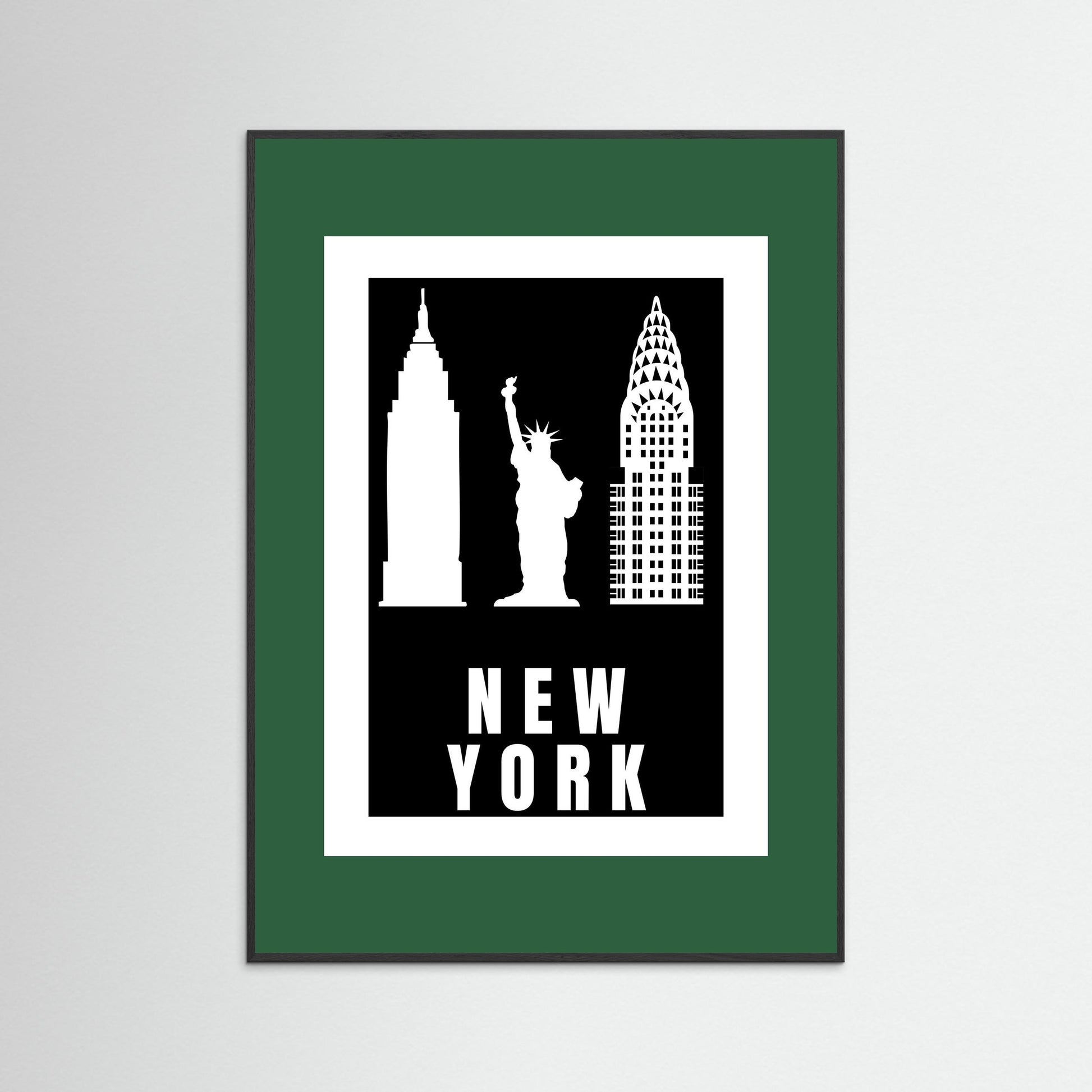 Framed artwork with New York City landmarks on a black background with a dark green border