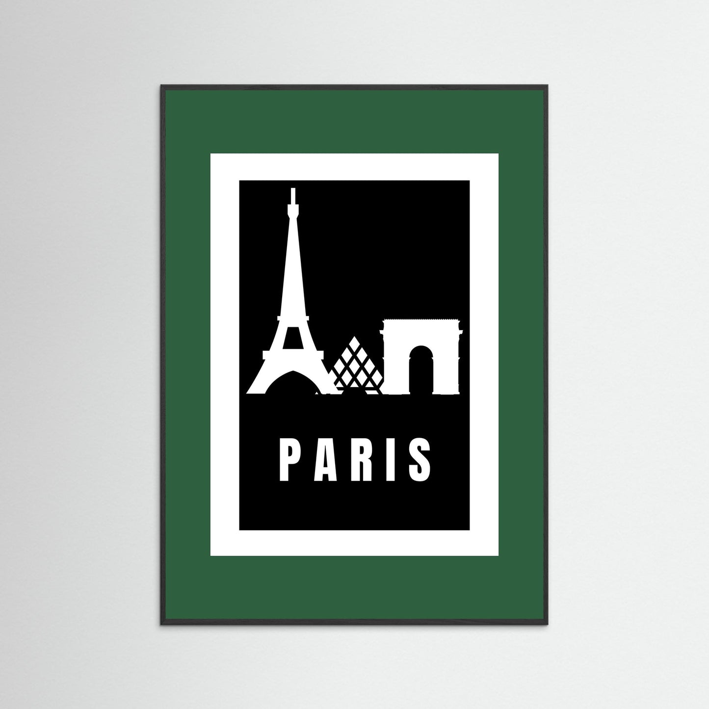 Framed poster with Eiffel Tower and Arc de Triomphe silhouettes and 'PARIS' text on a black background. Framed with a dark green border