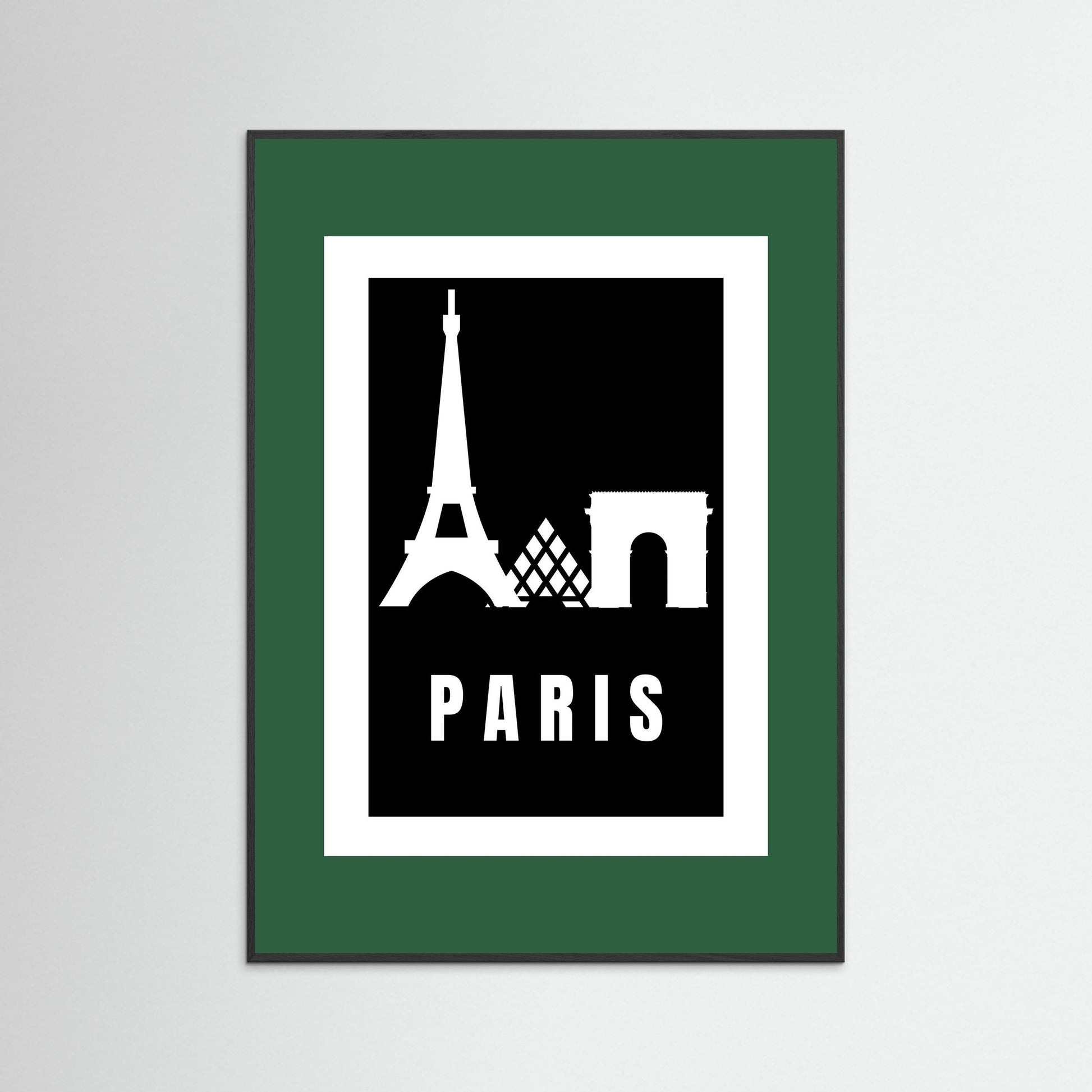 Framed poster with Eiffel Tower and Arc de Triomphe silhouettes and 'PARIS' text on a black background. Framed with a dark green border