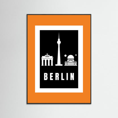 Framed poster with Berlin landmarks and 'BERLIN' text on a black background with an orange border.