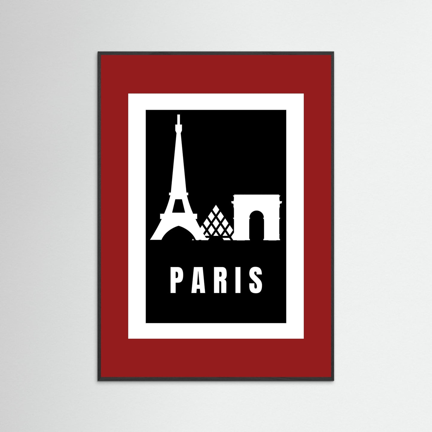 Framed poster with Eiffel Tower and Arc de Triomphe silhouettes on a black background with 'PARIS' text, framed in red.