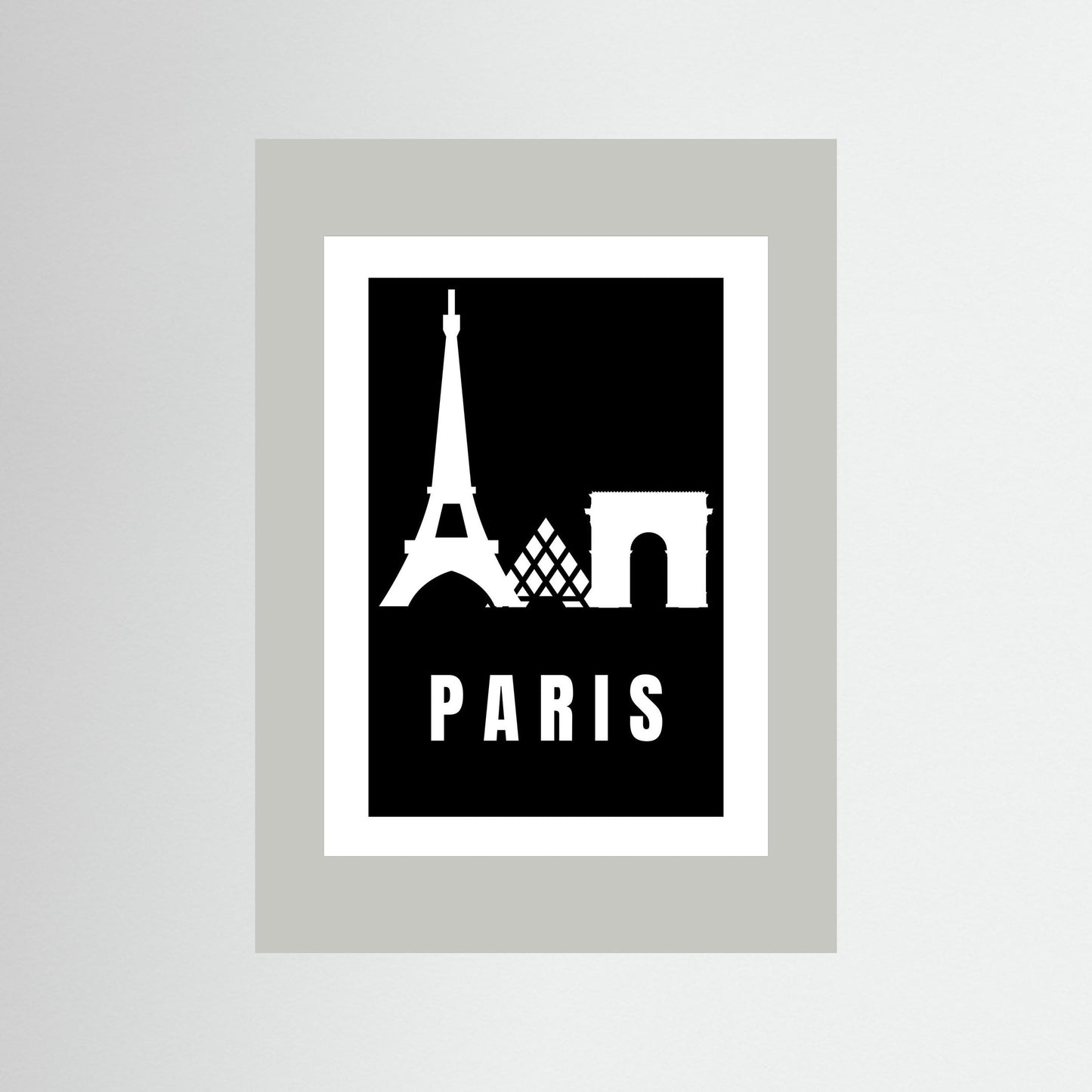 Framed poster with Eiffel Tower and Arc de Triomphe silhouettes on a black background with 'PARIS' text. Framed in light grey