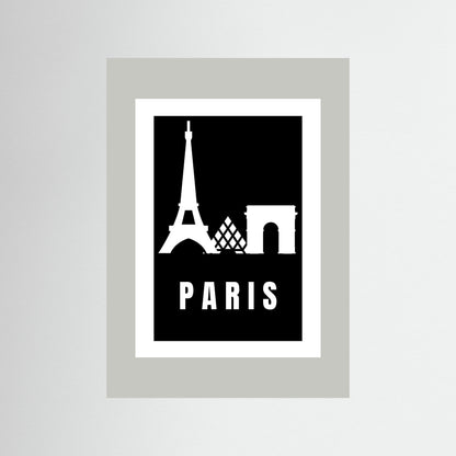 Framed poster with Eiffel Tower and Arc de Triomphe silhouettes on a black background with 'PARIS' text. Framed in light grey